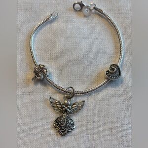925 sterling silver women’s bracelet with 3 FREE charms of your choice. 7” .